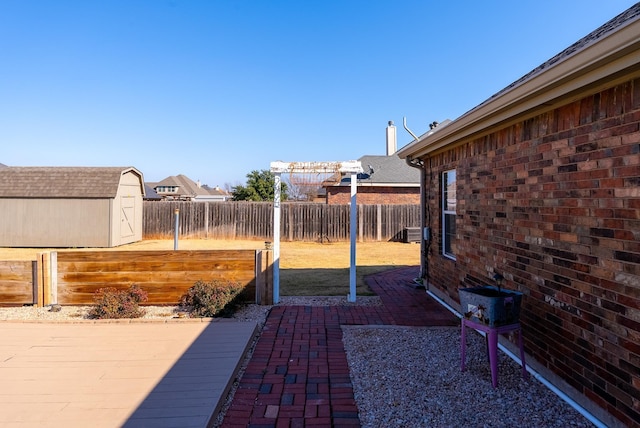 view of patio / terrace featuring a shed