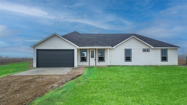 single story home with a garage and a front yard