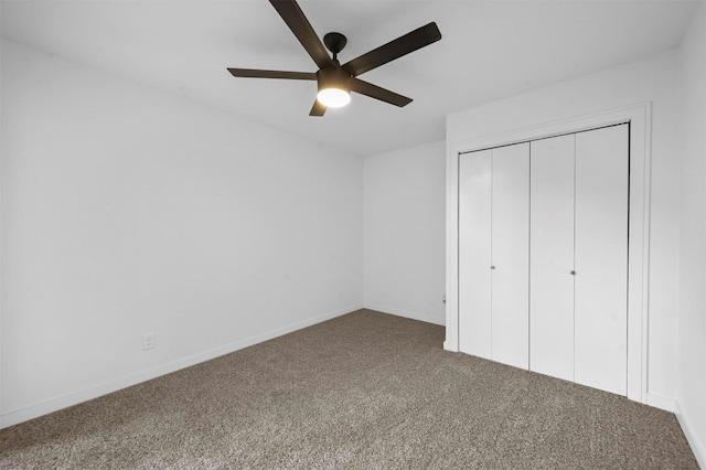 unfurnished bedroom featuring carpet floors, ceiling fan, and a closet