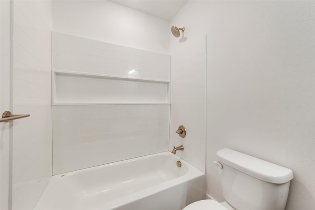 bathroom with tiled shower / bath combo and toilet