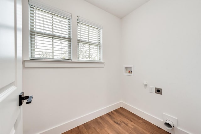 washroom with electric dryer hookup, hookup for a gas dryer, hookup for a washing machine, and wood-type flooring