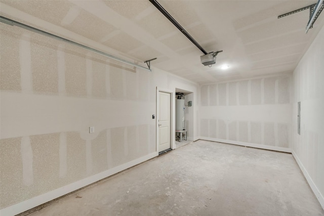 garage featuring a garage door opener and water heater