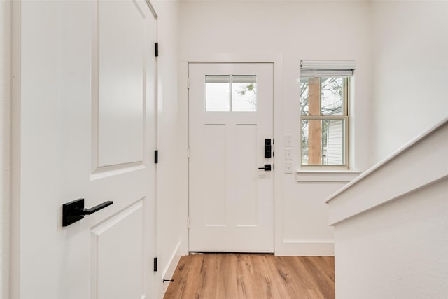 entryway with light hardwood / wood-style flooring