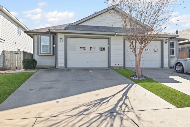 ranch-style home featuring a garage