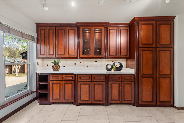 kitchen featuring light tile patterned floors and decorative backsplash