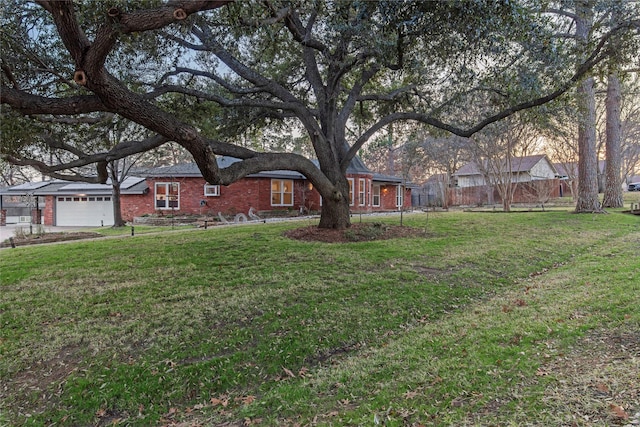 exterior space with a garage and a front yard