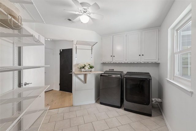 laundry area featuring cabinets, independent washer and dryer, a healthy amount of sunlight, and ceiling fan