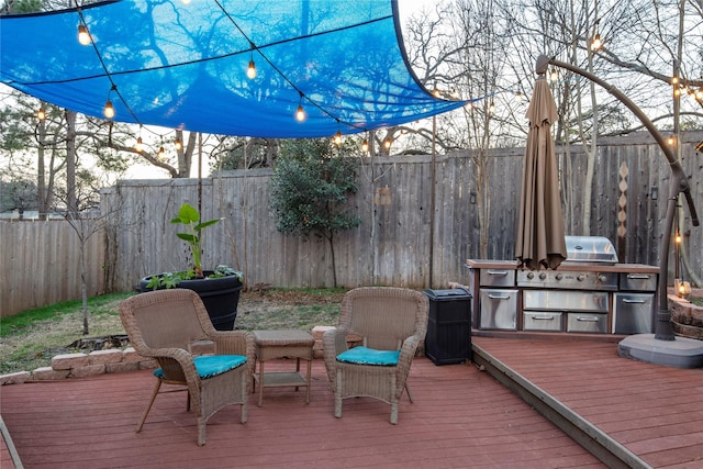 deck featuring an outdoor kitchen