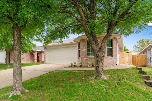 ranch-style home with a garage and a front lawn