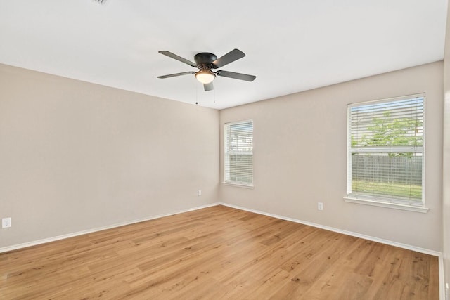 spare room with ceiling fan and light hardwood / wood-style floors