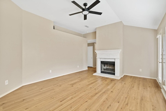 unfurnished living room with lofted ceiling, ceiling fan, and light wood-type flooring