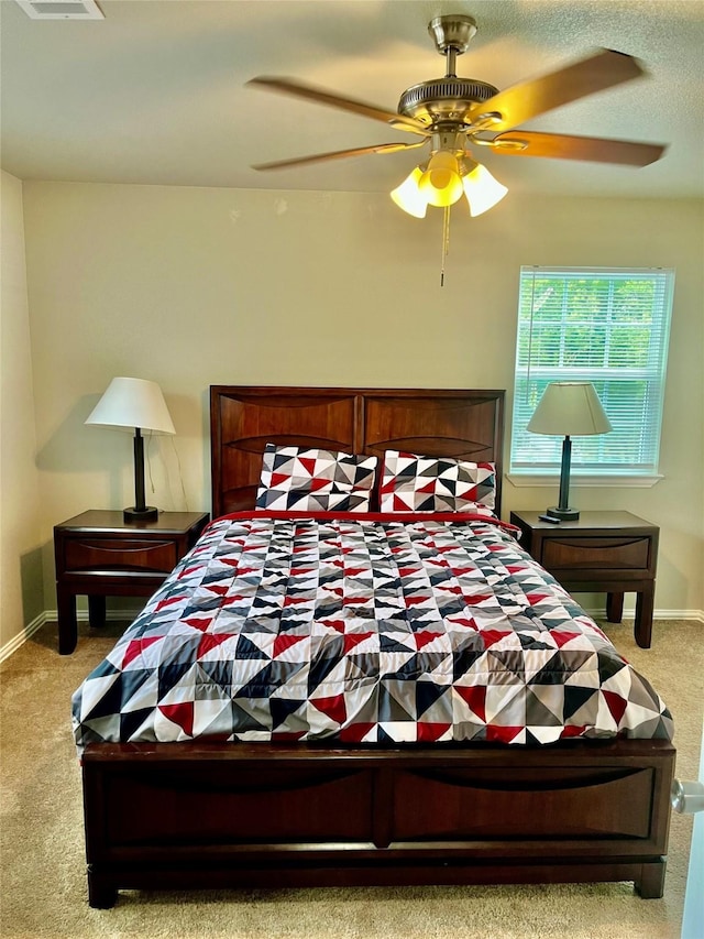 carpeted bedroom with ceiling fan