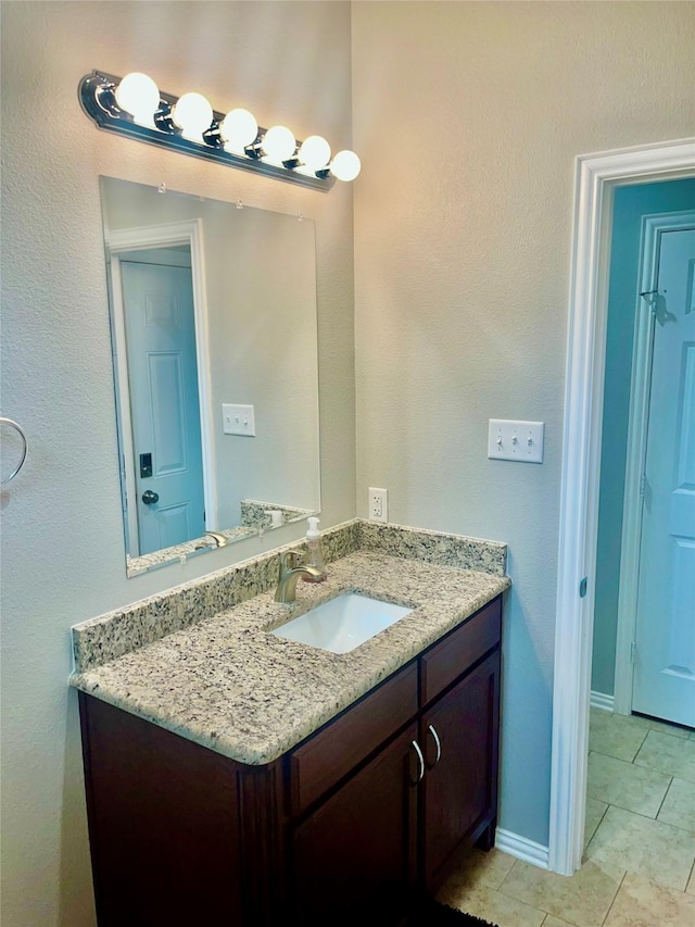 bathroom featuring vanity and tile patterned flooring