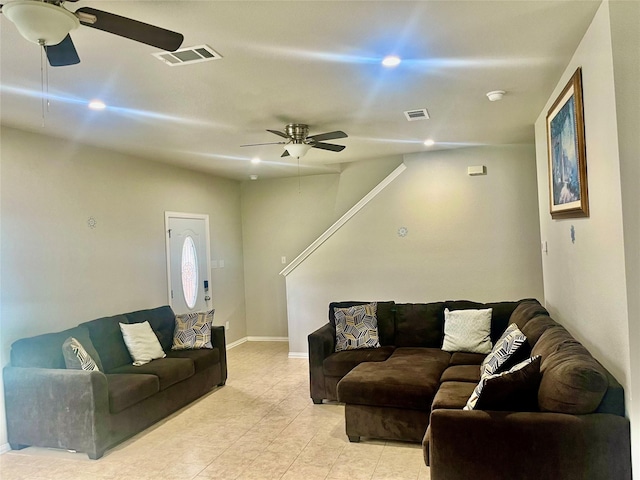 living room with light tile patterned floors and ceiling fan