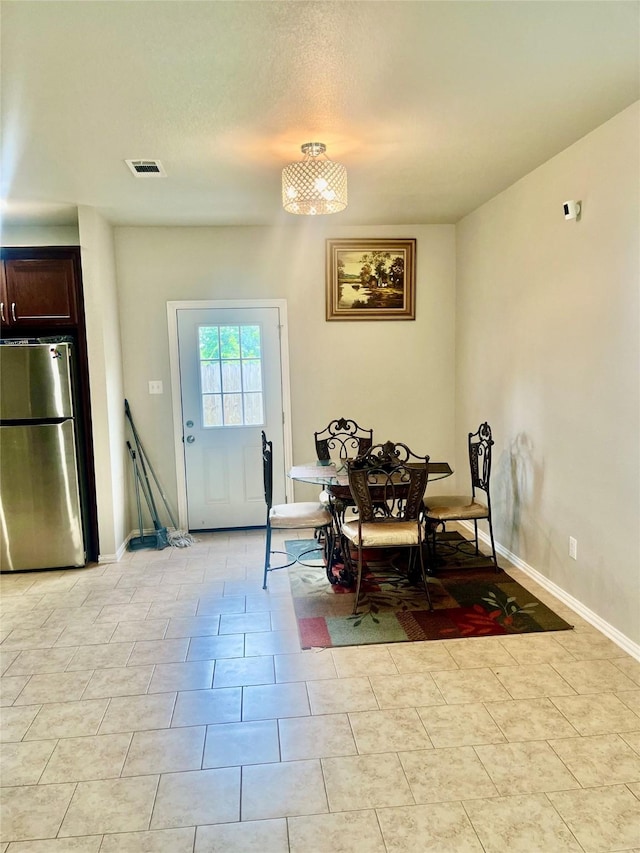 dining room featuring a textured ceiling