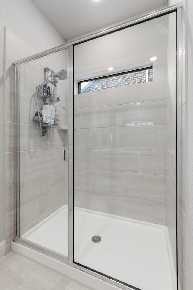 full bath with a shower stall