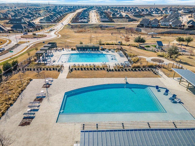 pool featuring a patio area and fence