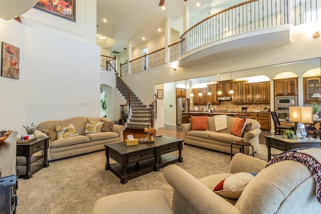 living room with a towering ceiling