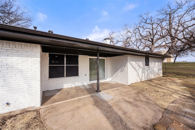 back of property featuring a patio area