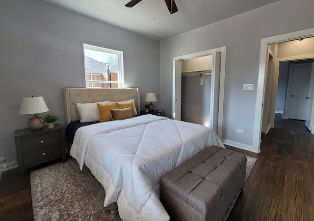 bedroom featuring ceiling fan, dark hardwood / wood-style floors, and a closet