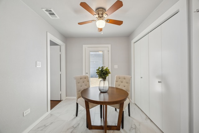 dining room with ceiling fan