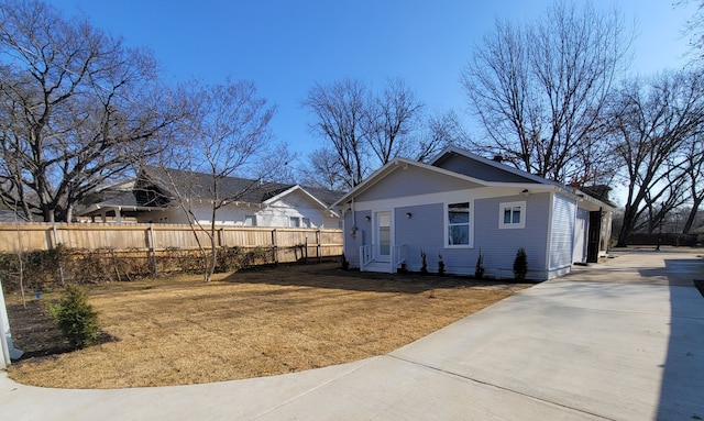 back of house with a lawn