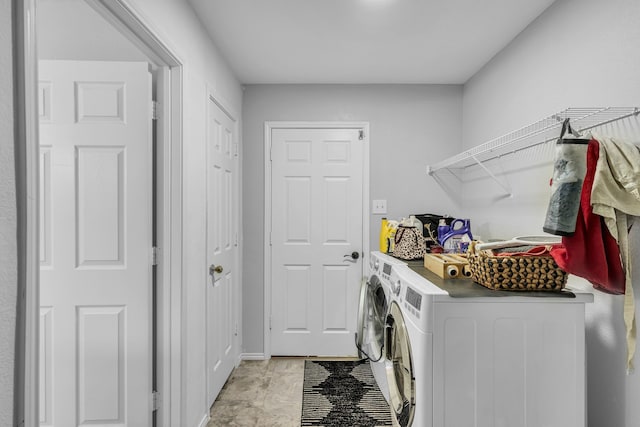 clothes washing area with independent washer and dryer