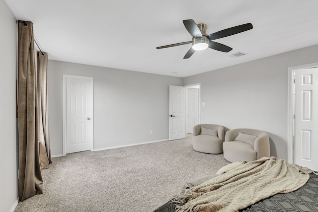 sitting room featuring ceiling fan and carpet flooring