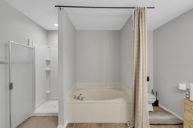 bathroom with shower with separate bathtub and toilet