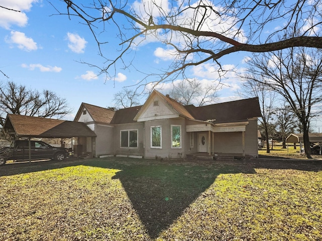 back of house with a yard