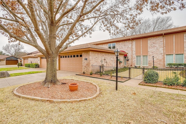 view of front of house with a garage and a front lawn