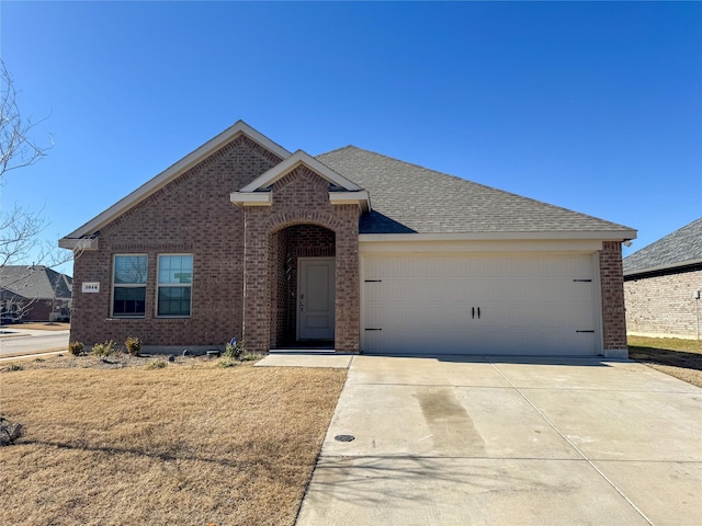 view of front of property with a garage