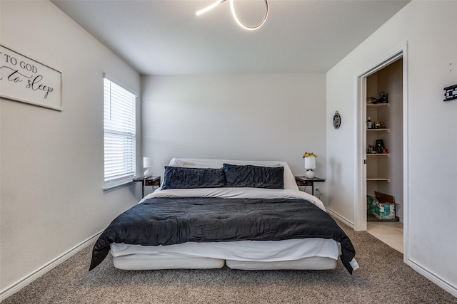 bedroom with carpet floors and baseboards