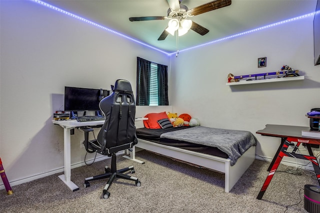 carpeted bedroom with a ceiling fan and baseboards