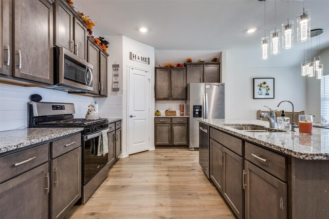 dining room with vaulted ceiling, hardwood / wood-style floors, and a wealth of natural light