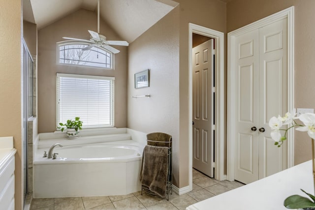 bathroom featuring tile patterned floors, lofted ceiling, shower with separate bathtub, vanity, and ceiling fan