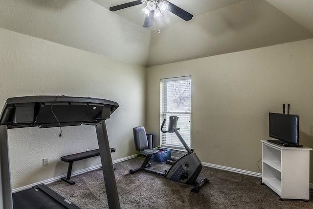 workout room featuring vaulted ceiling, ceiling fan, and dark carpet