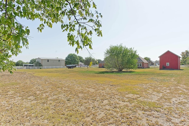 view of yard with a rural view