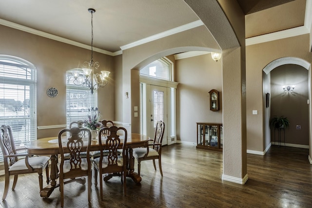 dining area with crown molding and dark hardwood / wood-style flooring