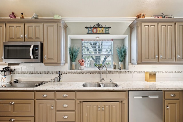 kitchen with sink, appliances with stainless steel finishes, light stone counters, ornamental molding, and decorative backsplash