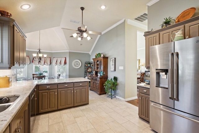 kitchen with ceiling fan with notable chandelier, lofted ceiling, stainless steel appliances, crown molding, and light stone countertops