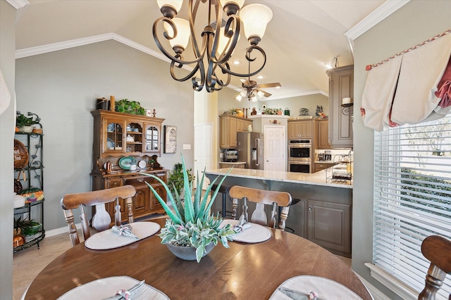 dining area with crown molding, lofted ceiling, and ceiling fan with notable chandelier