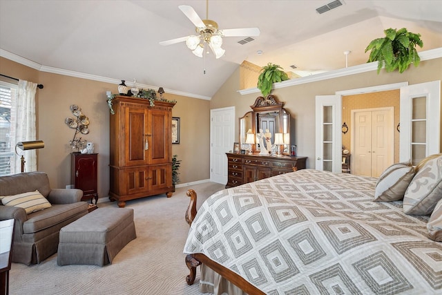 bedroom featuring lofted ceiling, crown molding, light colored carpet, and ceiling fan