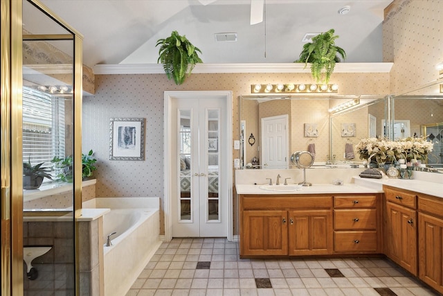 bathroom with vanity and a tub