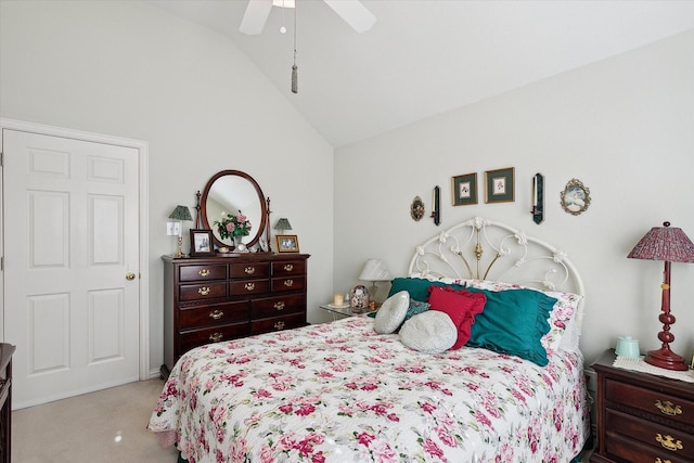 bedroom with lofted ceiling, light colored carpet, and ceiling fan