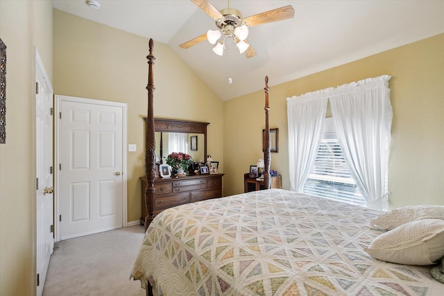 bedroom with light carpet, vaulted ceiling, and ceiling fan