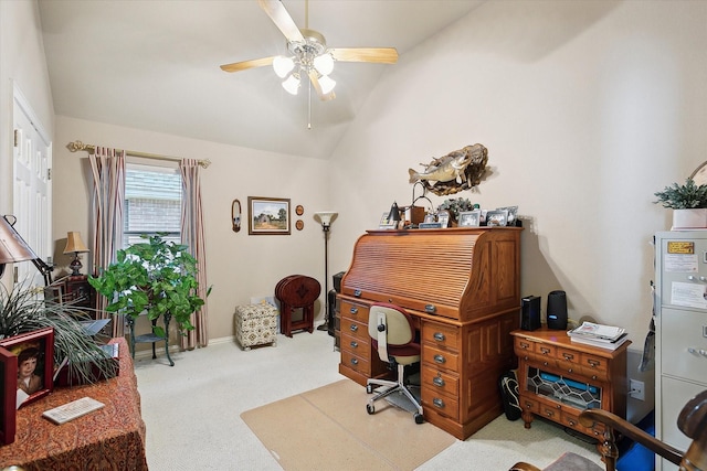 carpeted office featuring vaulted ceiling and ceiling fan