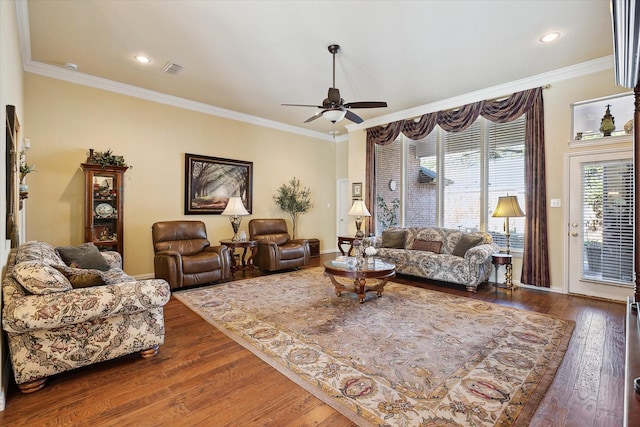 living room with dark hardwood / wood-style flooring, ornamental molding, and ceiling fan