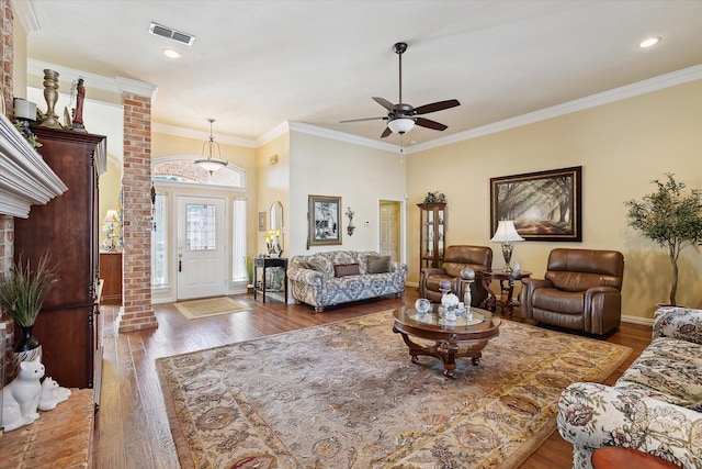 living room featuring ornamental molding, dark hardwood / wood-style floors, and ceiling fan