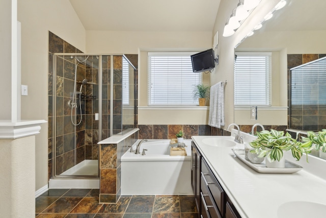 bathroom featuring vanity and separate shower and tub